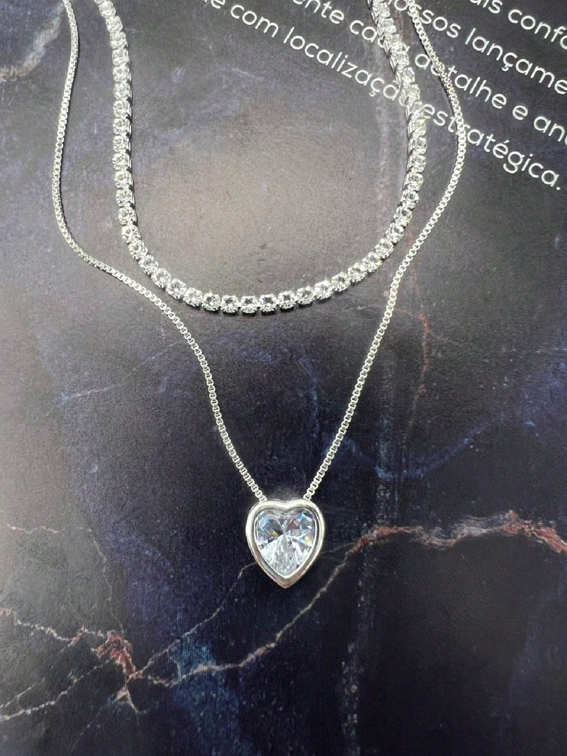 Vendedor Indicado
KIT 2 Choker Riviera Cristal + Colar Com coração Ponto De Luz Prateado Folheado Banhada A Prata