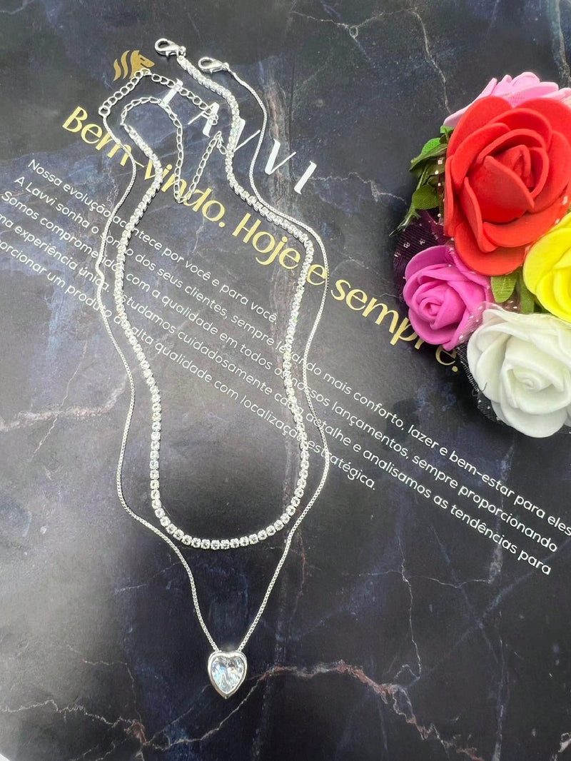 Vendedor Indicado
KIT 2 Choker Riviera Cristal + Colar Com coração Ponto De Luz Prateado Folheado Banhada A Prata
